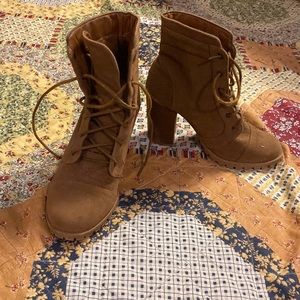Brown heeled lace up boots